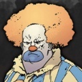 Angry clown with ginger hair avatar.